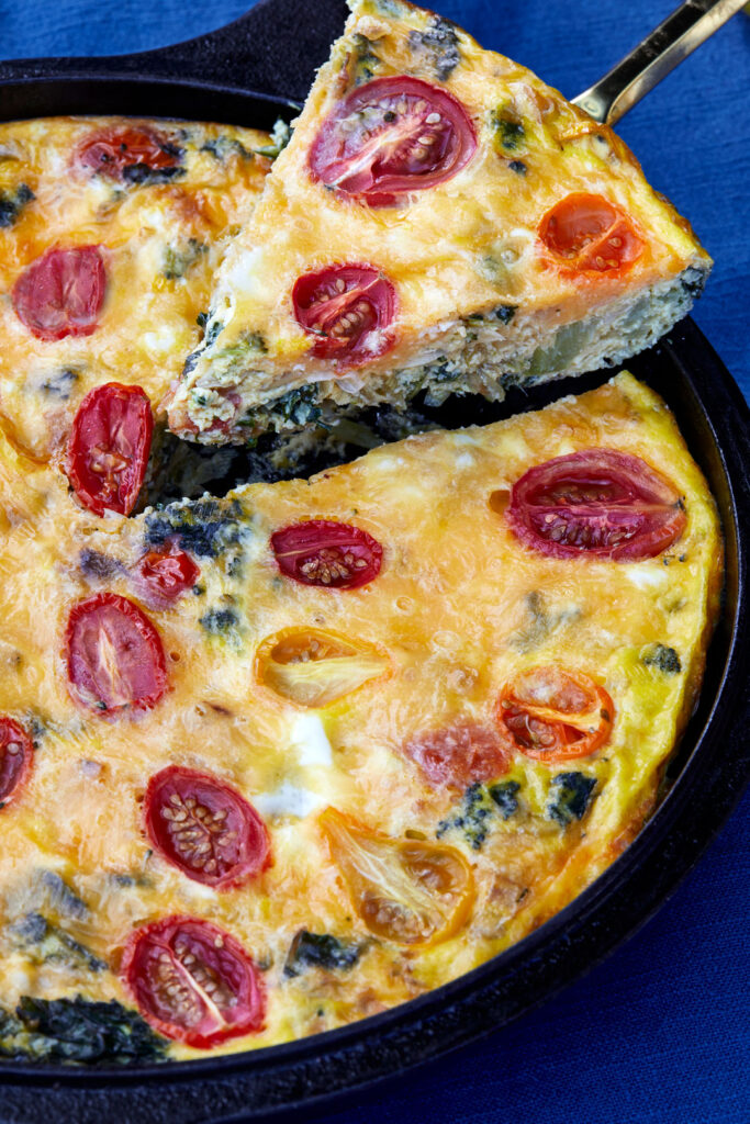 veggie frittata slice coming out of the pan for all your leftovers